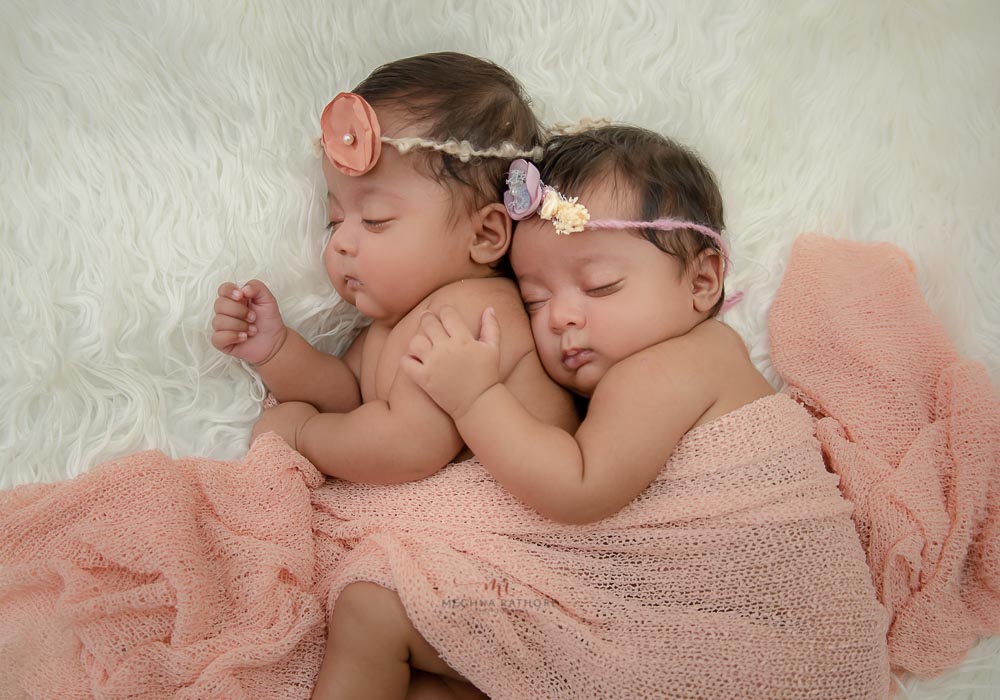 delhi newborn baby photoshoot twin babies hugging each other and sleeping meghna rathore photography