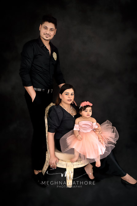 Family portrait with one year old baby girl all posing at meghna rathore photograhy in delhi gurgaon