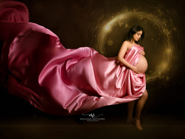 Maternity Album - Photoshoot with Grand Rust Gown, Elegant Blue Gown and a Pink Drape With Many Artistic edits By Meghna Rathore Photography