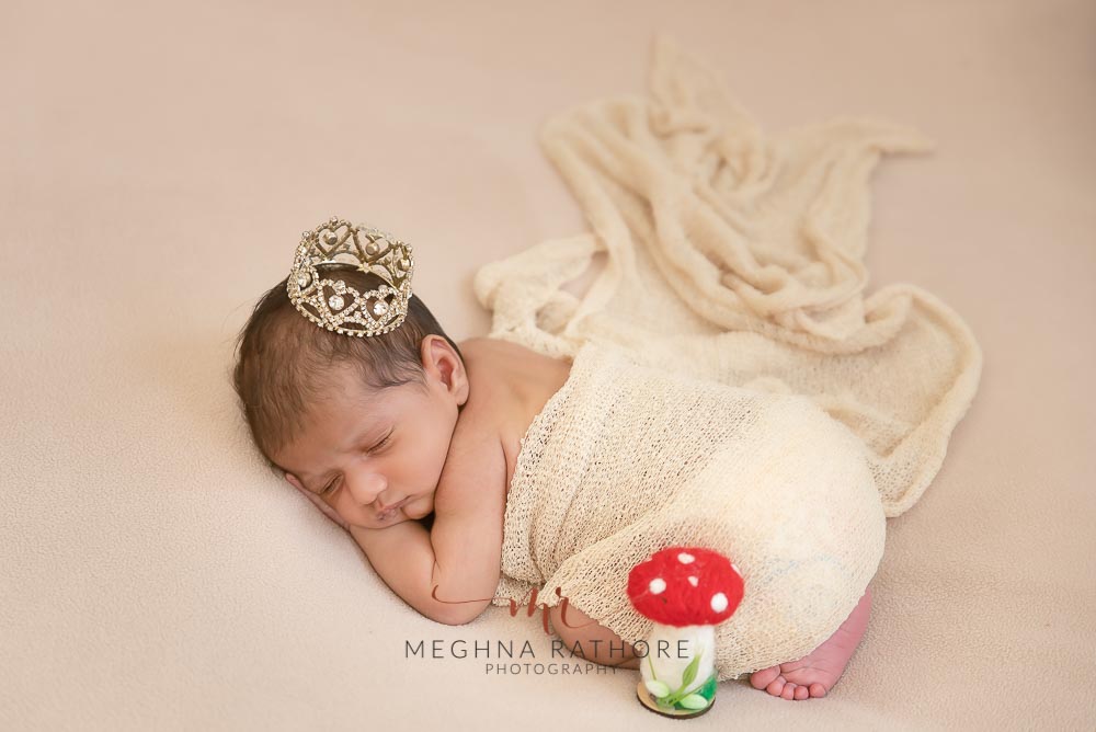 Newborn baby boy with white backdrops and props at meghna rathore photography in Delhi