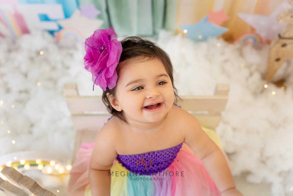 1 year old cute girl photo shoot poses for cake smash