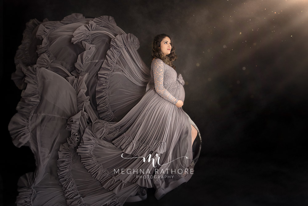 India Best Maternity Photographer in Gurugram, Pregnancy Photoshoot in Grey dress to be mom in flying pose