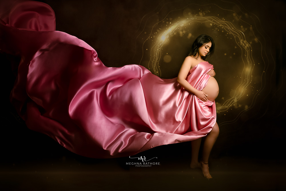 Maternity Album - Photoshoot with Grand Rust Gown, Elegant Blue Gown and a Pink Drape With Many Artistic edits By Meghna Rathore Photography