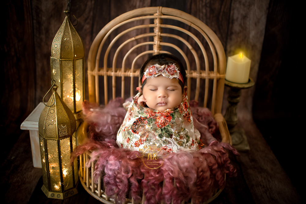 Newborn Gallery –  40 Days Girl Newborn Photoshoot With Blue, Greens, Reds, Pink Floral and Props Setups