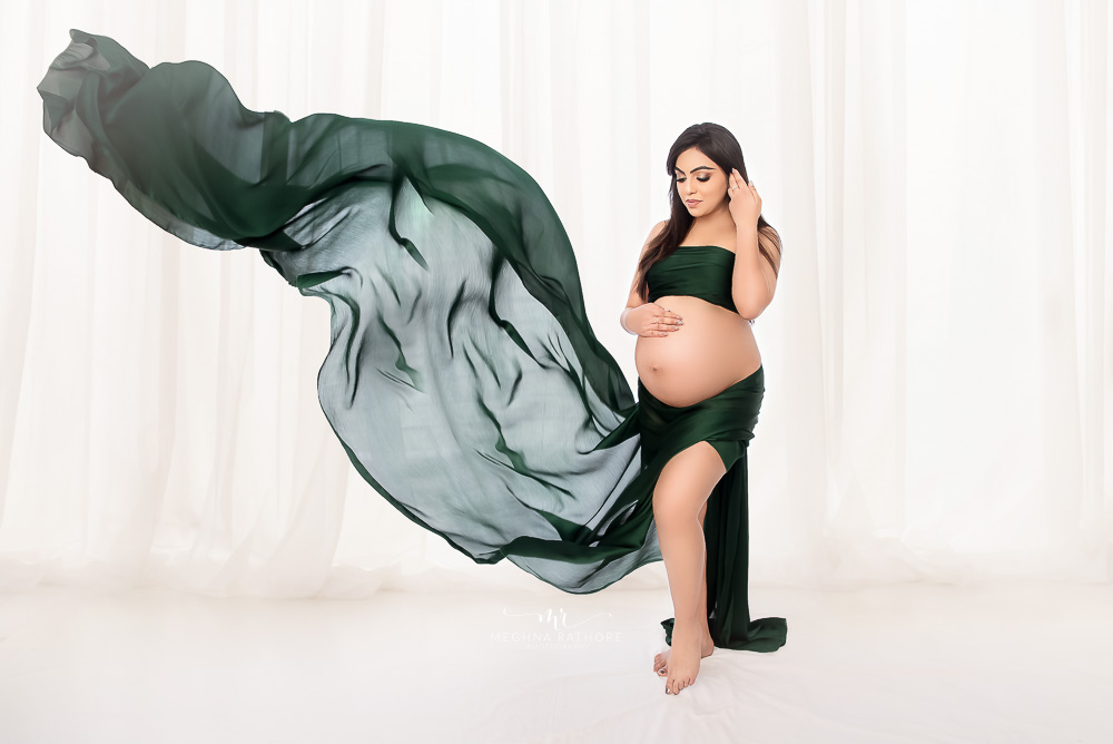 Maternity Gallery - Gorgeous Mommy to Be  Maternity Photoshoot in Purpe Gown and Green Drape.
