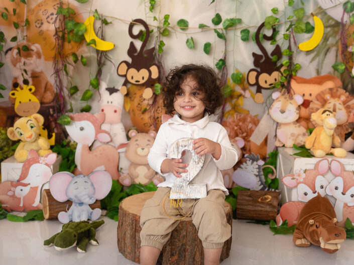 Kids Gallery - 1 Year Boy Pre Birthday Photoshoot With Family And Big Brother in Cowboy and Jungle Theme.