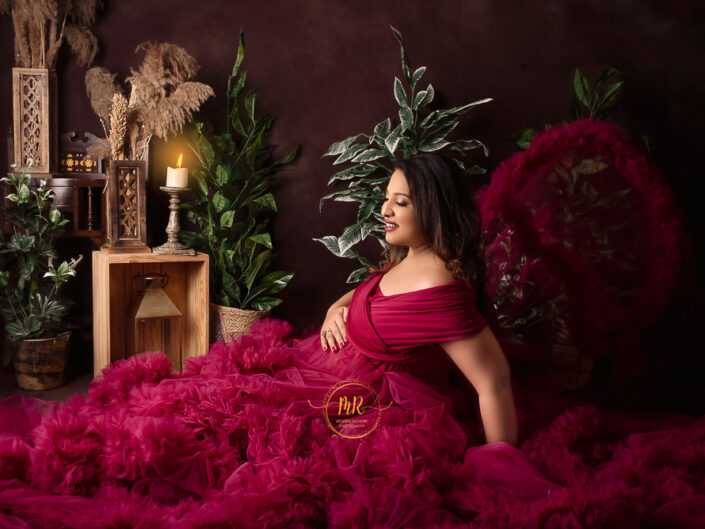 Maternity Album - Beautiful Maternity Photoshoot In Fluffy Pink and Rust Gown along with White Drape.