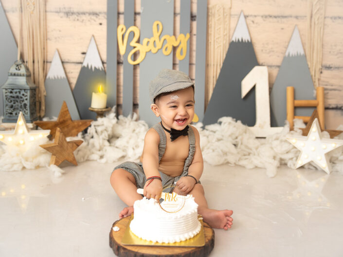 Kids Album – 1 Year Boy Photoshoot in Blue, Grey Mountain and Travel Theme With Cake Smash