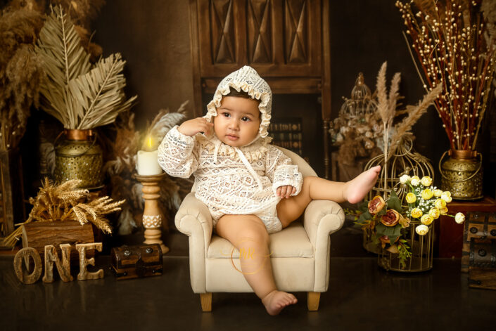 A baby’s first birthday is celebrated in an elegant and vintage setting, making it a memorable and charming moment. by the best photographer Meghna Rathore Delhi NCR, Haryana, maternity and child photographer.